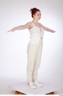 Yeva beige lace up top beige pants casual dressed standing…